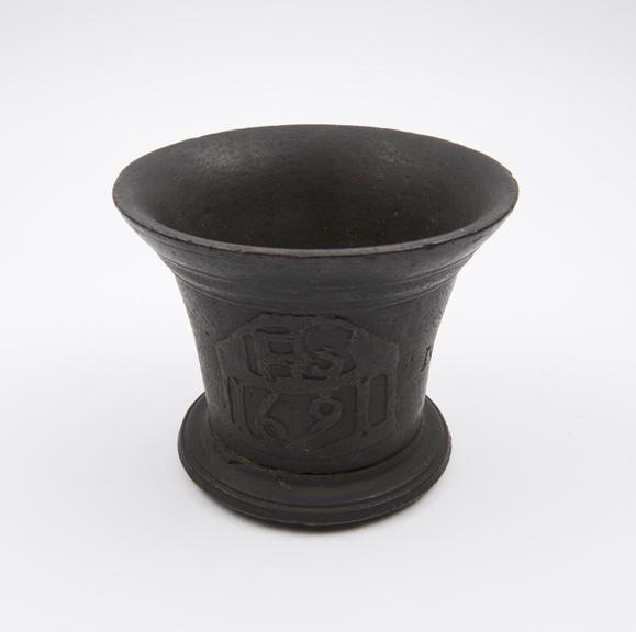 Small bronze mortar, flared rim, flat projecting foot