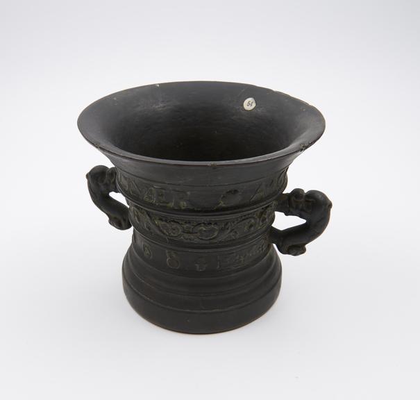 Large bell shaped mortar, wide flared rim, high moulded foot