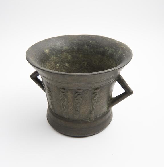 Bell-shaped mortar, flared rim and base, angled handles