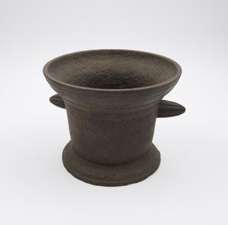 Large bell-shaped iron mortar