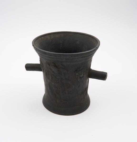 Tall thin bronze mortar, flared rim and foot, flat base