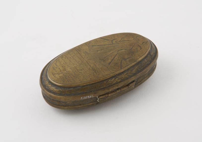 Brass tobacco box with hinged lid, oval