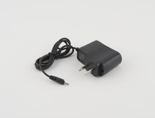 Power supply for Okia G18 mobile telephone, 2007-2012