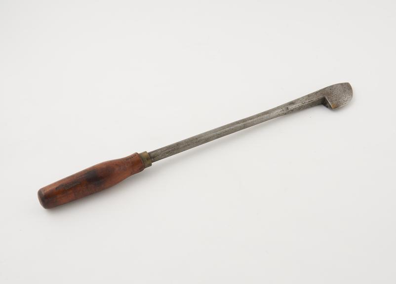 Firing iron, steel and wood, probably British, 19th century