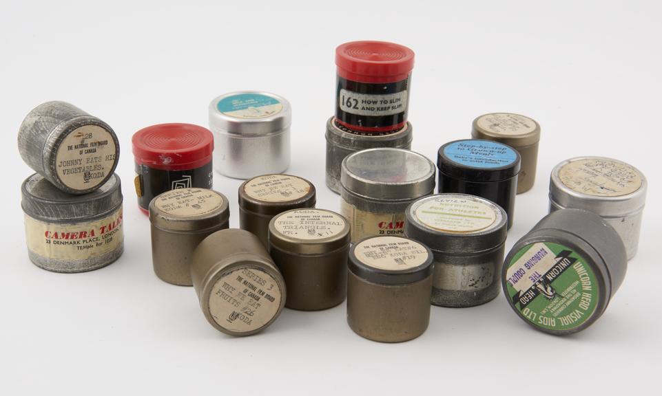 Seventeen film strips, in metal containers