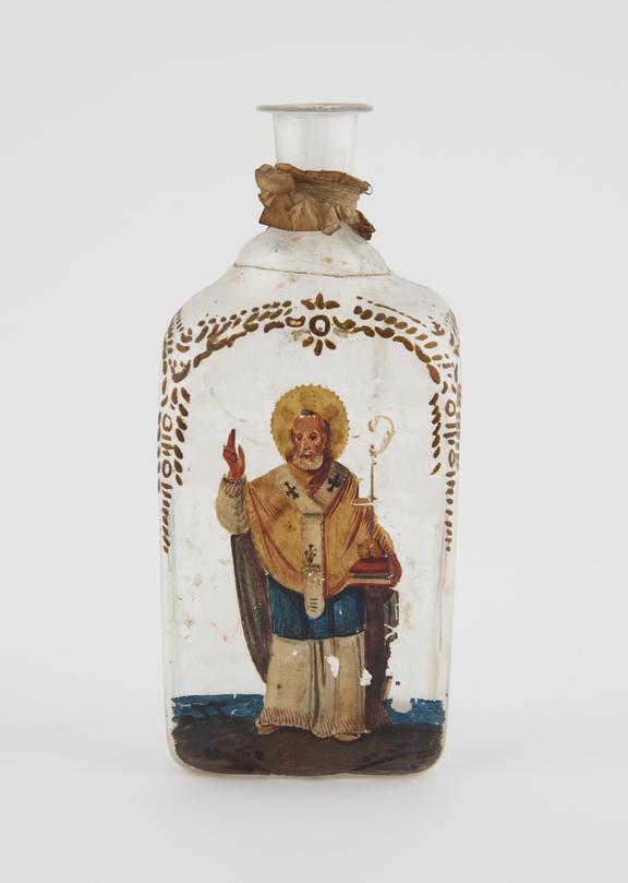 Glass bottle with Saint painted on side