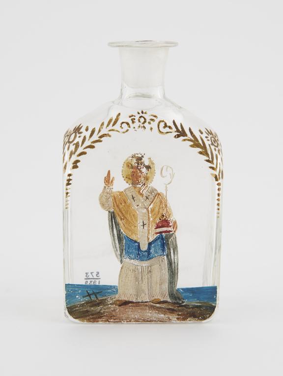 Glass bottle with Saint painted on side