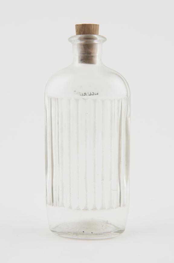 Oval, clear glass bottle with cork stopper, English, 1900-1950