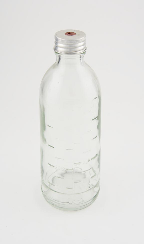 Blood collection bottle with metal and rubber cap