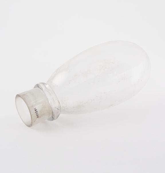 Clear glass flask, elongated oval body, tubular neck