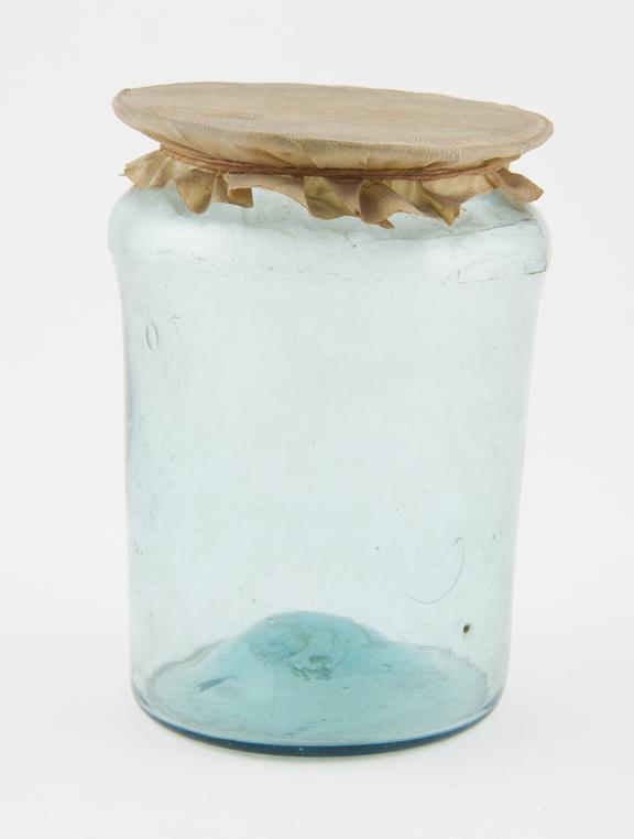 Glass drug jar, with parchment cover