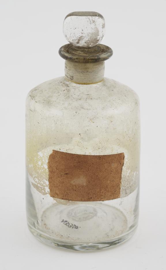 Clear glass shop-round, cylindrical, pontil mark on base