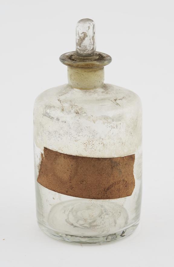 Clear glass shop-round, cylindrical, pontil mark on base