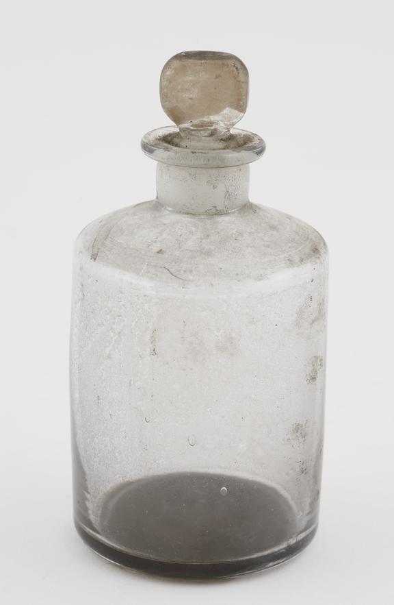 Clear glass shop-round, cylindrical, pontil mark on base