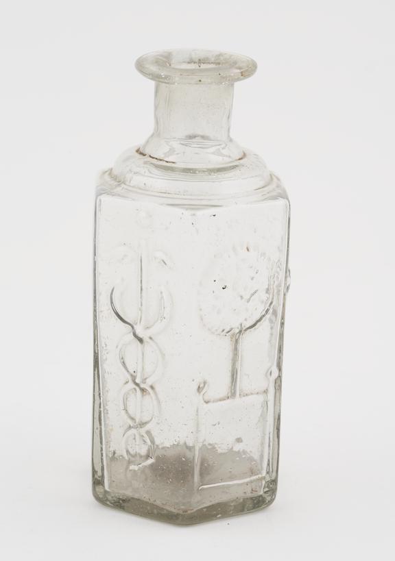 Clear glass bottle, with moulded decoration