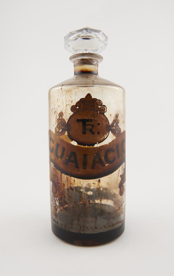 Bottle, clear glass with contents