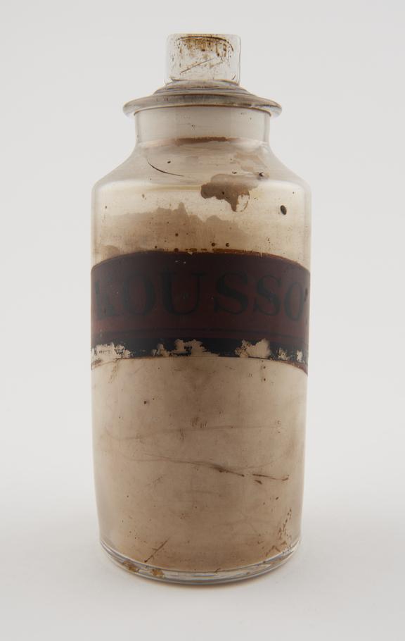 Bottle, clear glass, with contents, for cusso powder, English