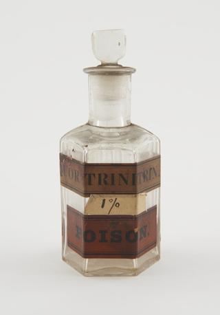 Poison bottle, clear glass, labelled "Liquor Trinitrate"