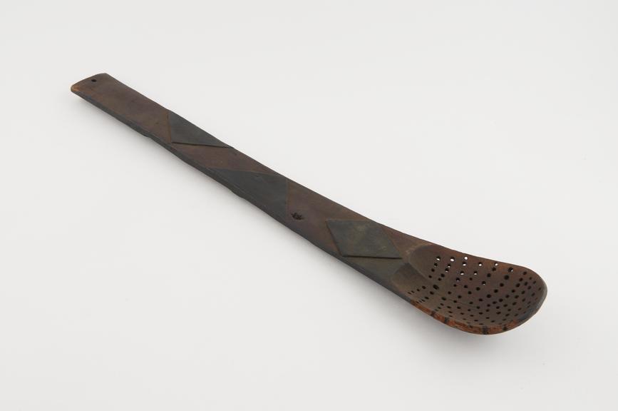 Wooden spoon-like strainer, date and provenance unknown