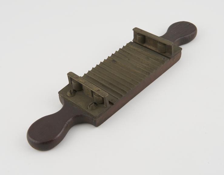 Slider only from pill cutter, of hardwood and brass