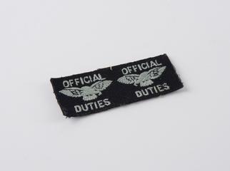 Badge, cloth, oblong, inscribed twice with: 'OFFICIAL DUTIES', worn by a Royal Aircraft Factory person