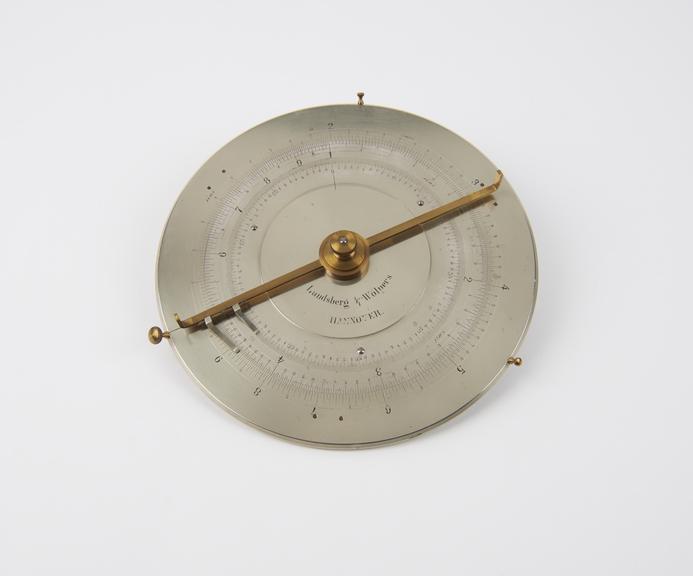 Slide rule, circular, silvered brass