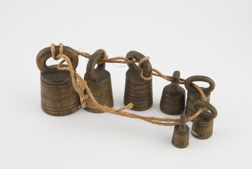 Set of 7 brass weights, 19th century