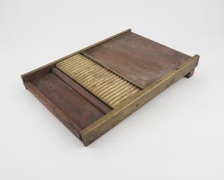 Base of a pill cutting and pill making machine