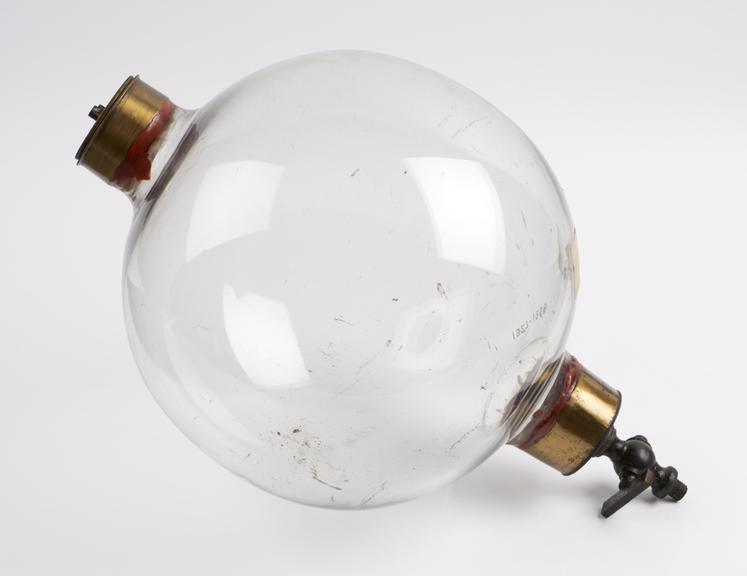 Glass sphere with brass collars