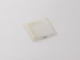 Processing device to couple amino acids by the `tea bag' method to build synthetic peptides