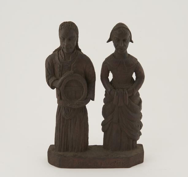 Dutch wooden carving of man and woman, connected with dysentery