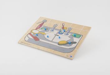 Wooden puzzle board showing a washbasin