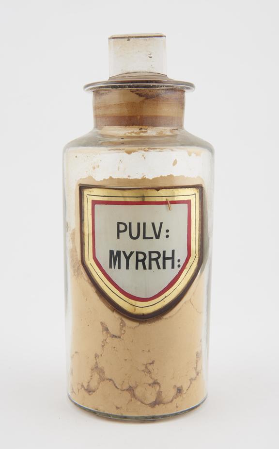 Shop round, glass-fronted label PULV: MYRRH: (Myrrh powder)