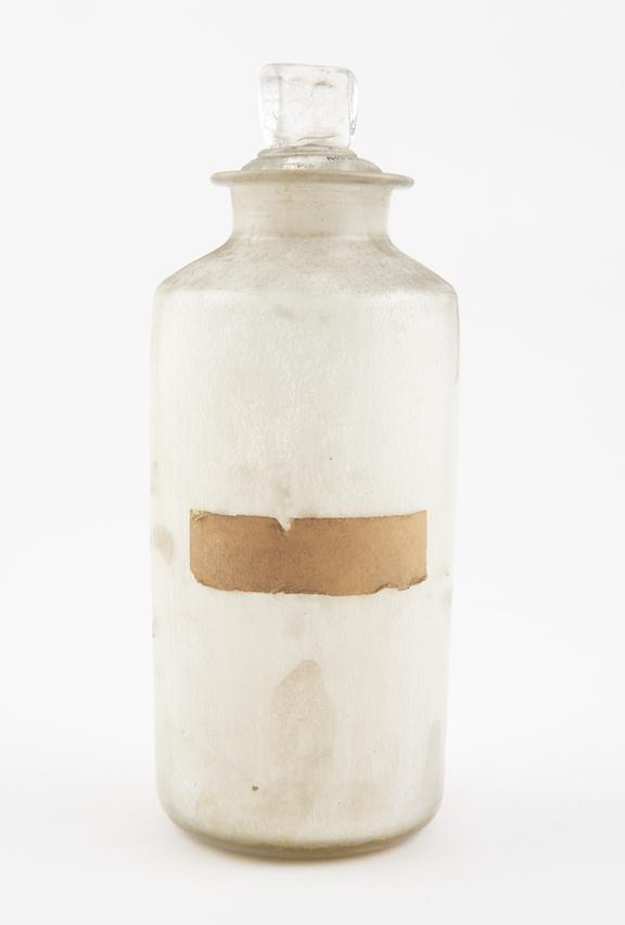 Bottle, clear glass, with contents, English, late 19th century