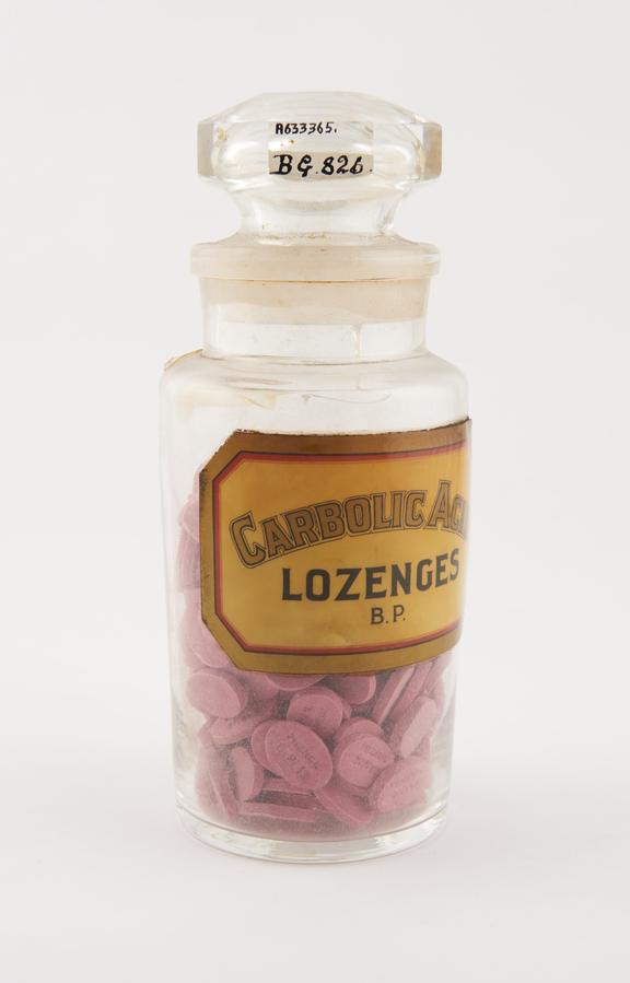 Bottle, clear glass, with contents, for carbolic acid lozenges