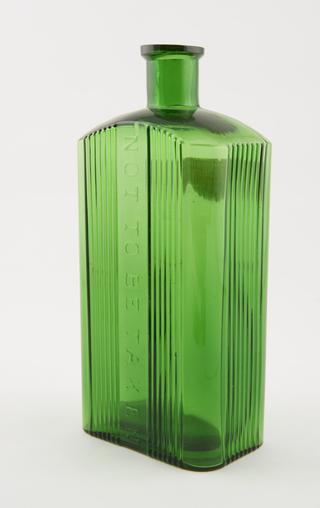 Poison bottle, emerald green glass, labelled