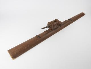 Crude wooden tripod for telescope.