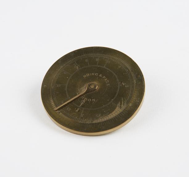 Circular slide rule in brass, by Dring & Fage, London