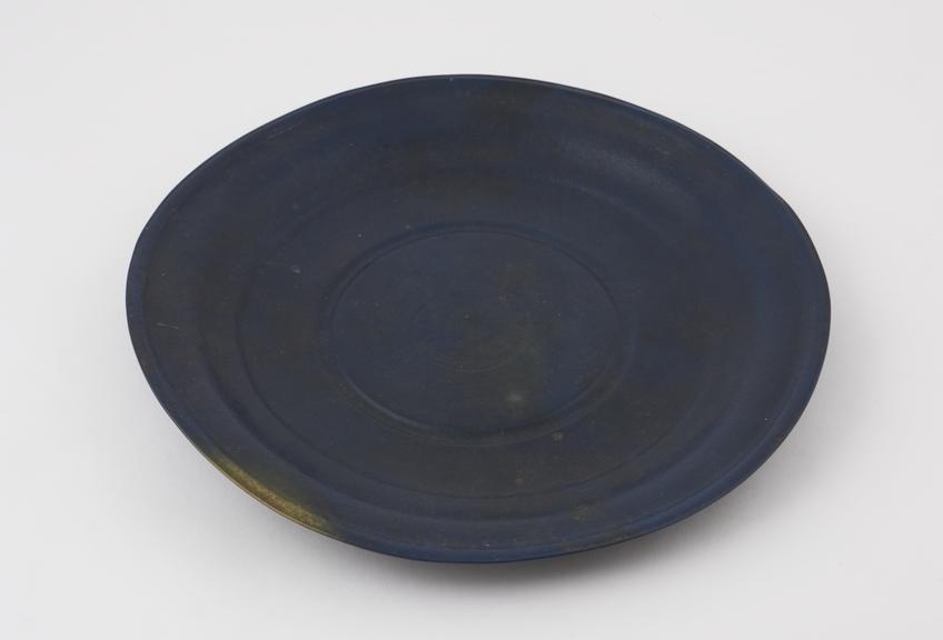 Circular moulded and decorated dish of prussian blue moulded