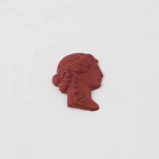 Female head in bottle green Parkesine