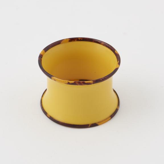 Napkin ring of yellow cellulose nitrate trimmed with