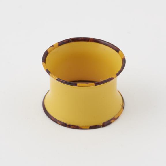 Napkin ring of yellow cellulose nitrate trimmed with