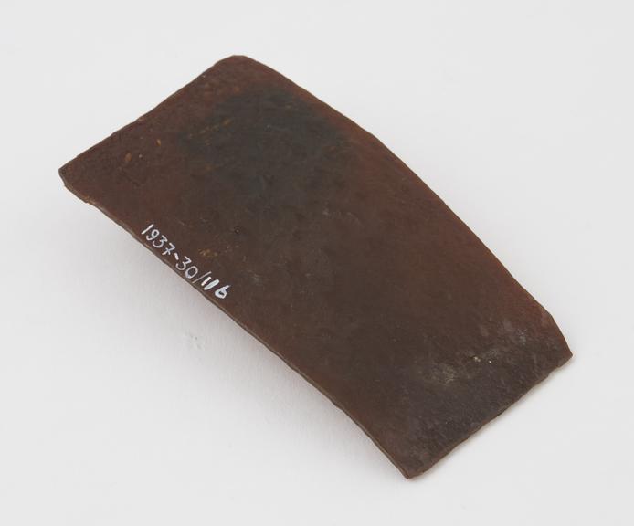 Rectangular flat pie of dark brown Parkesine, uneven surface