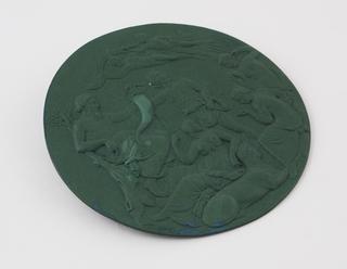 Circular moulded plaque of green Parkesine