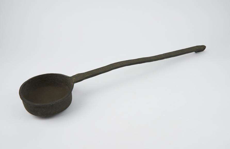 Bronze ladle with large bowl and long inscribed handle