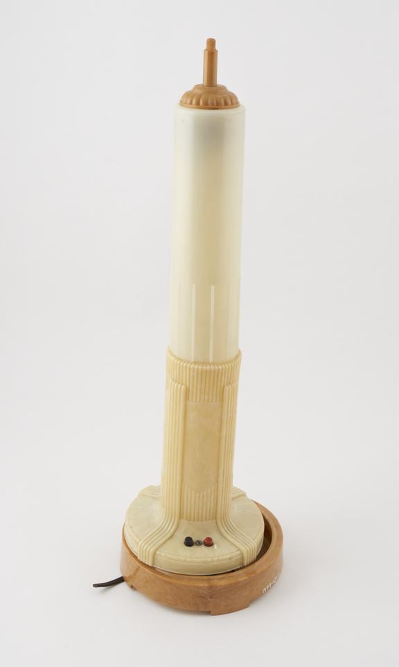 Cream and amber celluloid lamp modelled after the beacon on the