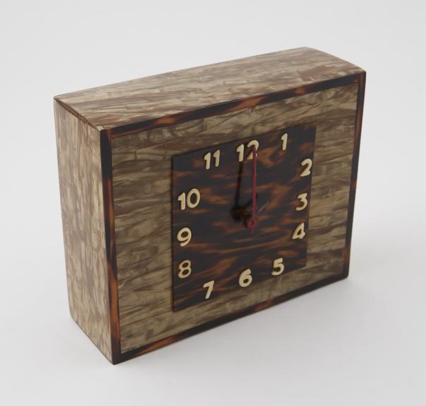 Rectangular clock of wood covered with cellulose nitrate which