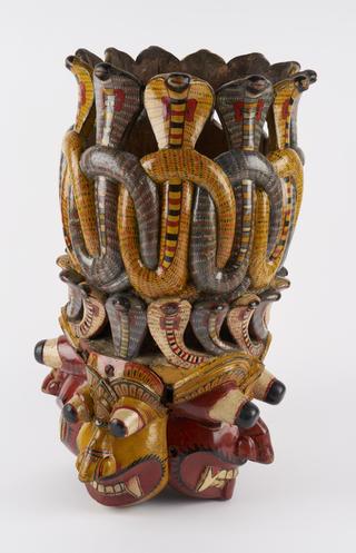 Polychrome mask with demonic faces