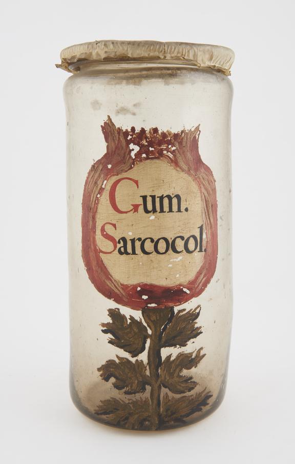 Glass drug jar, cylindrical, with parchment cover, labelled