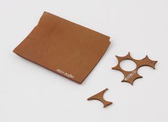 Flat brown sheet of Parkesine